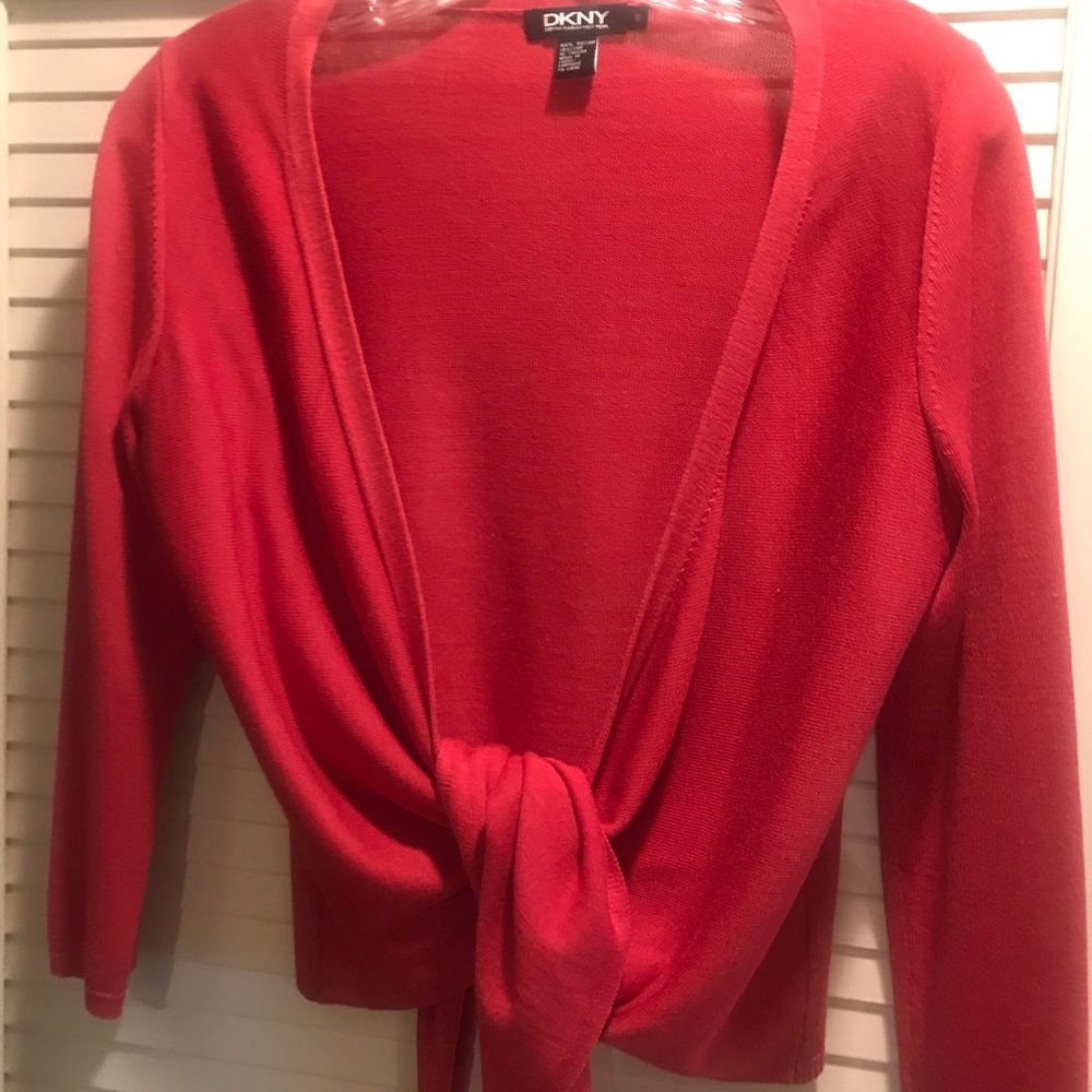 This is a sweet light weight red sweater that will be perfect for summer.